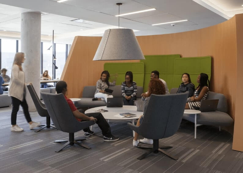 Group of people hanging out in a common area at Centennial Place