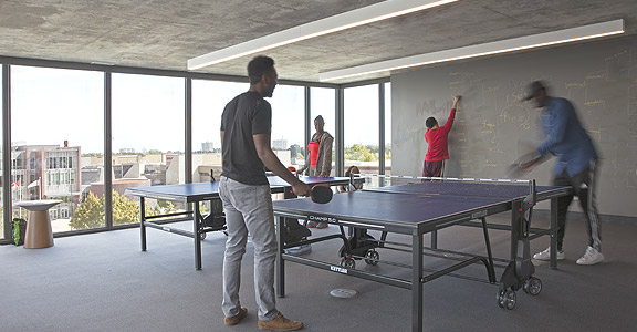 People playing ping pong at Centennial Place